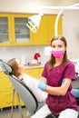 Portrait of female dentist doctor in the face mask posing at work place in the clinic Royalty Free Stock Photo