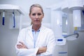 Portrait of female dentist standing with arms crossed Royalty Free Stock Photo