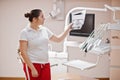 Portrait of female dentist woman standing in her dentistry office looking on x-ray photos Royalty Free Stock Photo