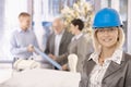 Portrait of female designer in hardhat