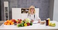 Portrait Of Female Dietician With Vegetables Royalty Free Stock Photo