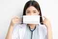 Portrait of female doctor instructing to wear a mask properly