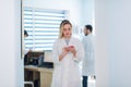 Portrait of female doctor with interns in background Royalty Free Stock Photo