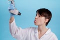 Portrait of female doctor looking at a CCTV camera and showing language as an idea of monitoring doctor at work