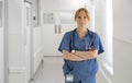 Portrait Of Female Doctor Nurse Or Surgeon Wearing Scrubs Standing In Hospital Corridor Royalty Free Stock Photo