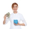 Portrait of female doctor with piggy bank Royalty Free Stock Photo