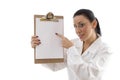 Portrait of female doctor pointing writing pad Royalty Free Stock Photo