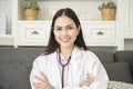 Portrait of Female doctor with stethoscope at office and smiling at camera Royalty Free Stock Photo