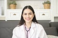 Portrait of Female doctor with stethoscope at office and smiling at camera Royalty Free Stock Photo