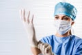 Female doctor Surgeon putting on surgical gloves Royalty Free Stock Photo