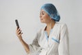 Portrait of female doctor using her mobile phone Royalty Free Stock Photo