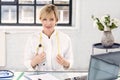 Portrait of female doctor working at desk in doctor`s office Royalty Free Stock Photo