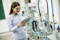 Female electronic engineer using digital tablet in the laborat