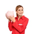 Portrait of female emergency doctor with piggy bank Royalty Free Stock Photo