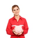 Portrait of female emergency doctor with piggy bank Royalty Free Stock Photo