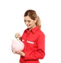Portrait of female emergency doctor putting money into piggy bank Royalty Free Stock Photo