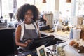 Portrait Of Female Employee Working At Delicatessen Checkout Royalty Free Stock Photo