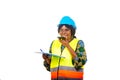 Portrait of female engineer in safety helmet working using mobile phone and clipboard, happy Royalty Free Stock Photo