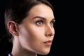 Portrait Of Female Face Staring Aside Over Black Background Royalty Free Stock Photo