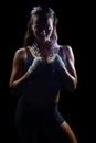 Portrait of female fighter holding chain around neck Royalty Free Stock Photo