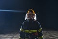 Portrait of a female firefighter standing and walking brave and optimistic