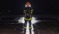 Portrait of a female firefighter standing and walking brave and optimistic
