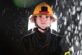 Portrait of a female firefighter standing and walking brave and optimistic.