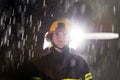 Portrait of a female firefighter standing and walking brave and optimistic.