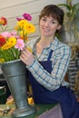 Portrait female florist smiling in flower shop