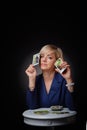 Portrait of a female fortune teller with tarot cards, on a black background Royalty Free Stock Photo