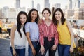 Portrait Of Female Friends Gathered On Rooftop Terrace For Party With City Skyline In Background Royalty Free Stock Photo