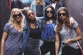 Portrait of female friends wearing sunglasses while staning together