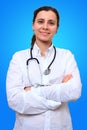 Portrait of female general practitioner in medical coat with stethoscope