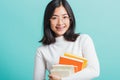 Portrait female in glasses is holding the books on hand Royalty Free Stock Photo