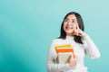 Portrait female in glasses is holding the books on hand Royalty Free Stock Photo