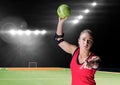 Portrait of a female handball player holding ball at handball court