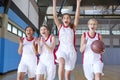 Portrait Of Female High School Basketball Team Celebrating On Court Royalty Free Stock Photo