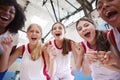 Portrait Of Female High School Basketball Team Celebrating With Coach Royalty Free Stock Photo