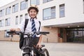 Portrait Of Female High School Student Wearing Uniform With Bicycle Outside School Buildings Royalty Free Stock Photo