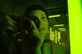Woman photographer capturing in neon light