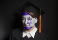 Portrait of Female Jewish bachelor with painted Flag of Israel in Black mantle and Graduation Cap