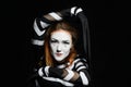 Portrait of female mime artist, black background Royalty Free Stock Photo