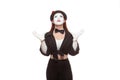 Portrait of a female mime artist performing, isolated on white background. Symbol of good news, happy event, come true Royalty Free Stock Photo