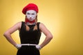Portrait of female mime isolated on yellow Royalty Free Stock Photo