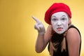 Portrait of female mime isolated on yellow Royalty Free Stock Photo