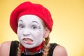 Portrait of female mime isolated on yellow Royalty Free Stock Photo