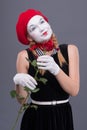 Portrait of female mime with red hat and white Royalty Free Stock Photo