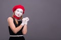 Portrait of female mime with red hat and white Royalty Free Stock Photo