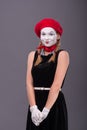 Portrait of female mime with red hat and white Royalty Free Stock Photo