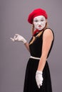Portrait of female mime in red head and with white Royalty Free Stock Photo